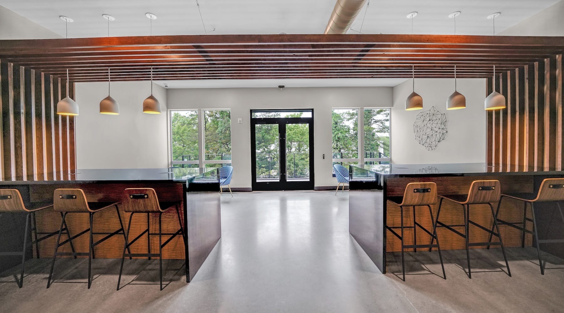 spacious lounge with colorful accents, decor and with ample, modern seating